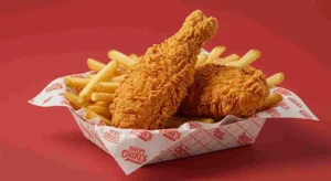 Two hot chicken tenders with fries